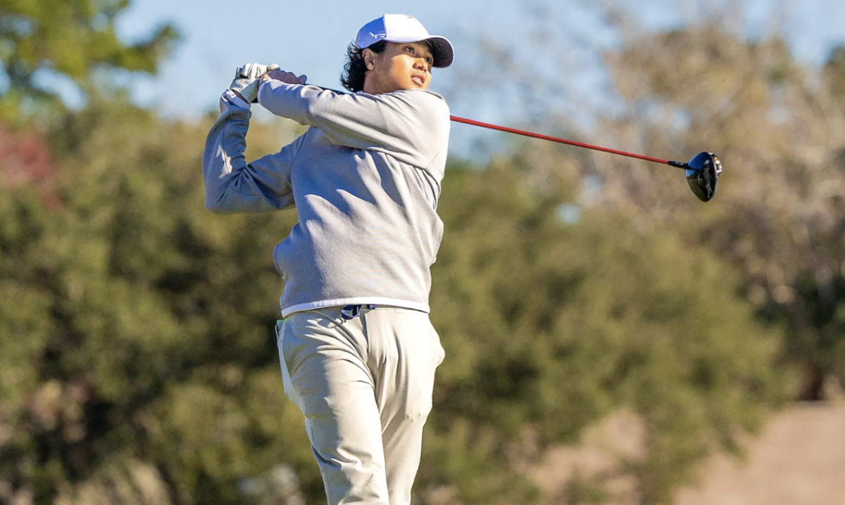 NaShawn Tyson swinging his club at one of his golf meets 